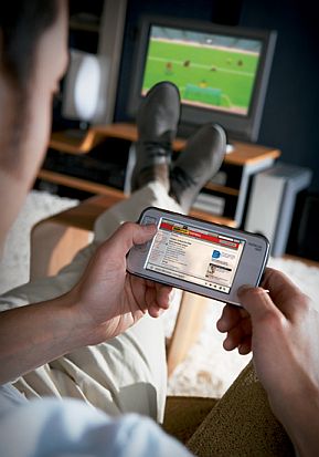 Guy on a sofa watching football