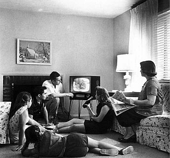 Family watching an old television