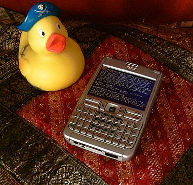 Rubber duck with a Nokia E61 running a text adventure