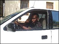 Zanzibar taxi driver with mobile phone