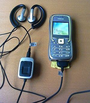 Nokia 5500 in music mode with headphones and stereo adaptor attached