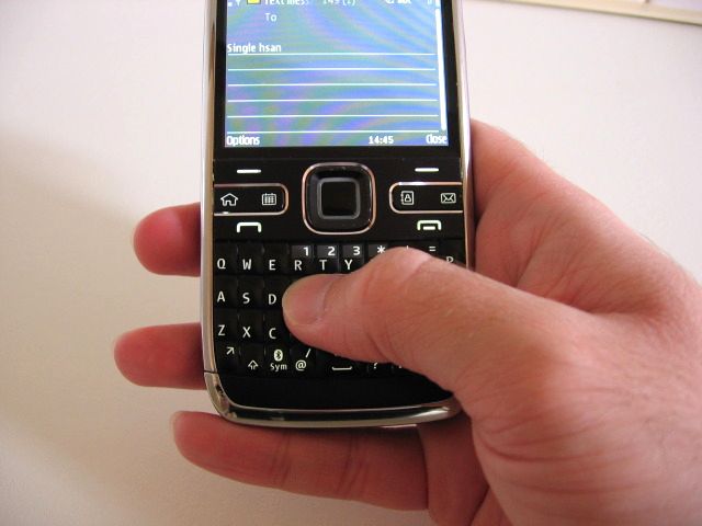 E72 typing text message with one hand