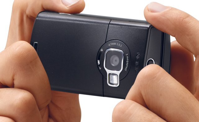 In Camera mode, note the macro sliding level to the left of the lens